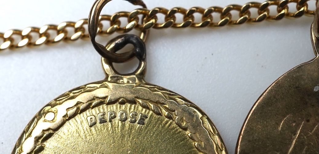 A gold necklace and pair of earrings